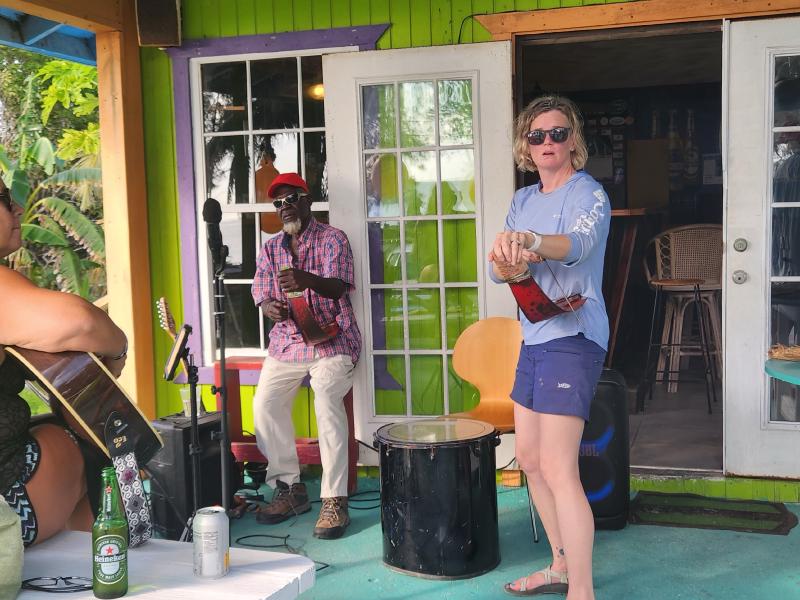 Pinky playing the saw during a 4hour long jam with Bahamaians and other cruisers at Da Smoke Pot in Cat Island